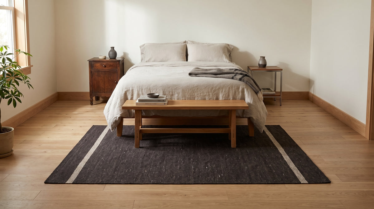 Charcoal Brown Artistic Flatweave Wool Rug in a bedroom