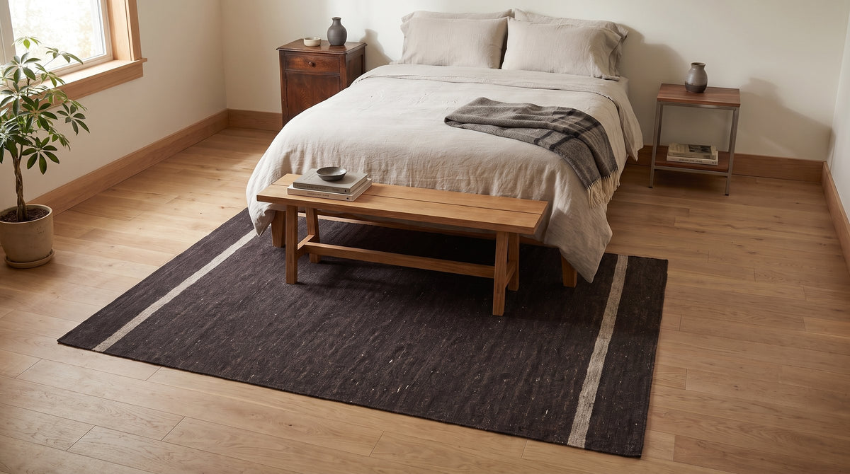 Charcoal Brown Artistic Flatweave Wool Rug in a bedroom