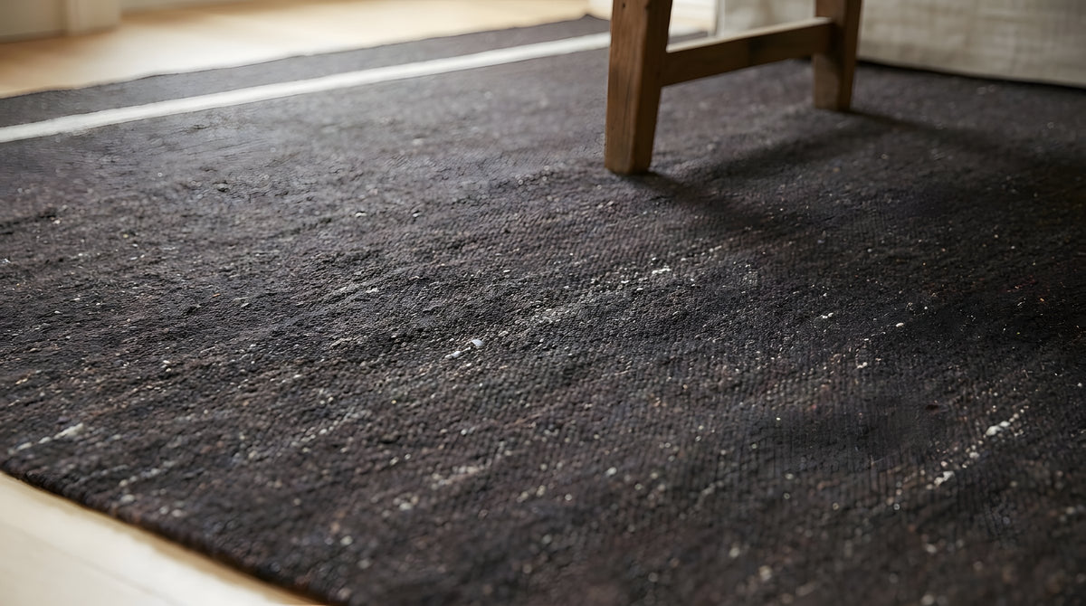 Charcoal Brown Artistic Flatweave Wool Rug in a living room