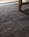 Charcoal Brown Artistic Flatweave Wool Rug in a living room