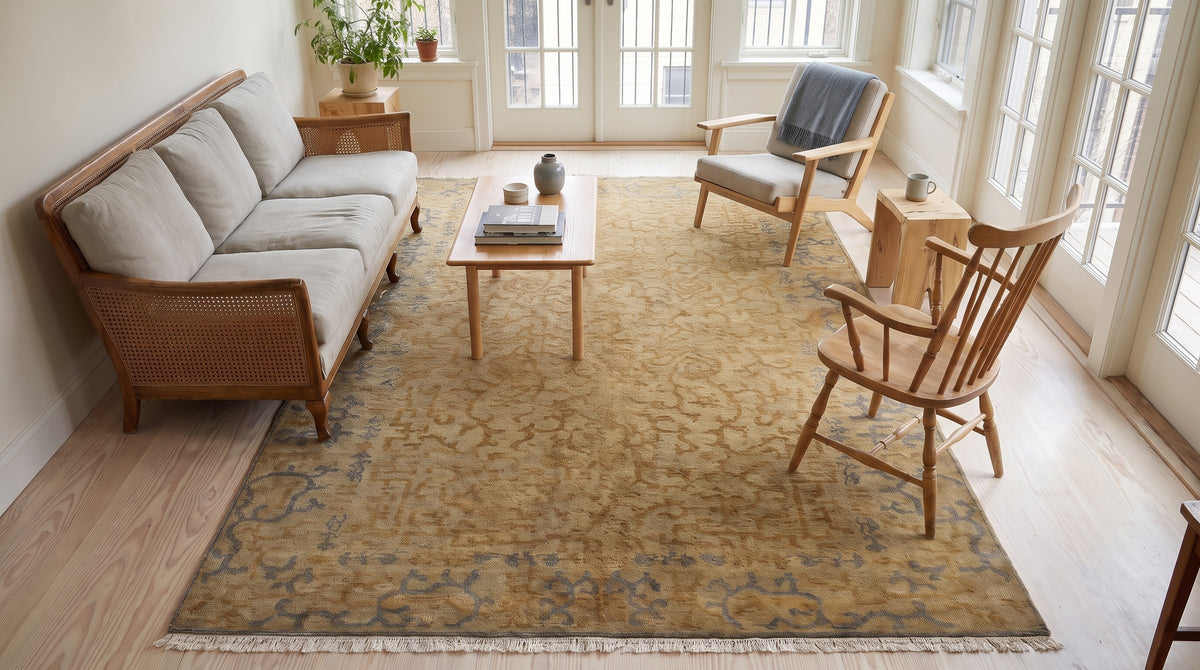 Warm Bianca Gold Hand Knotted Wool Rug in a sunroom