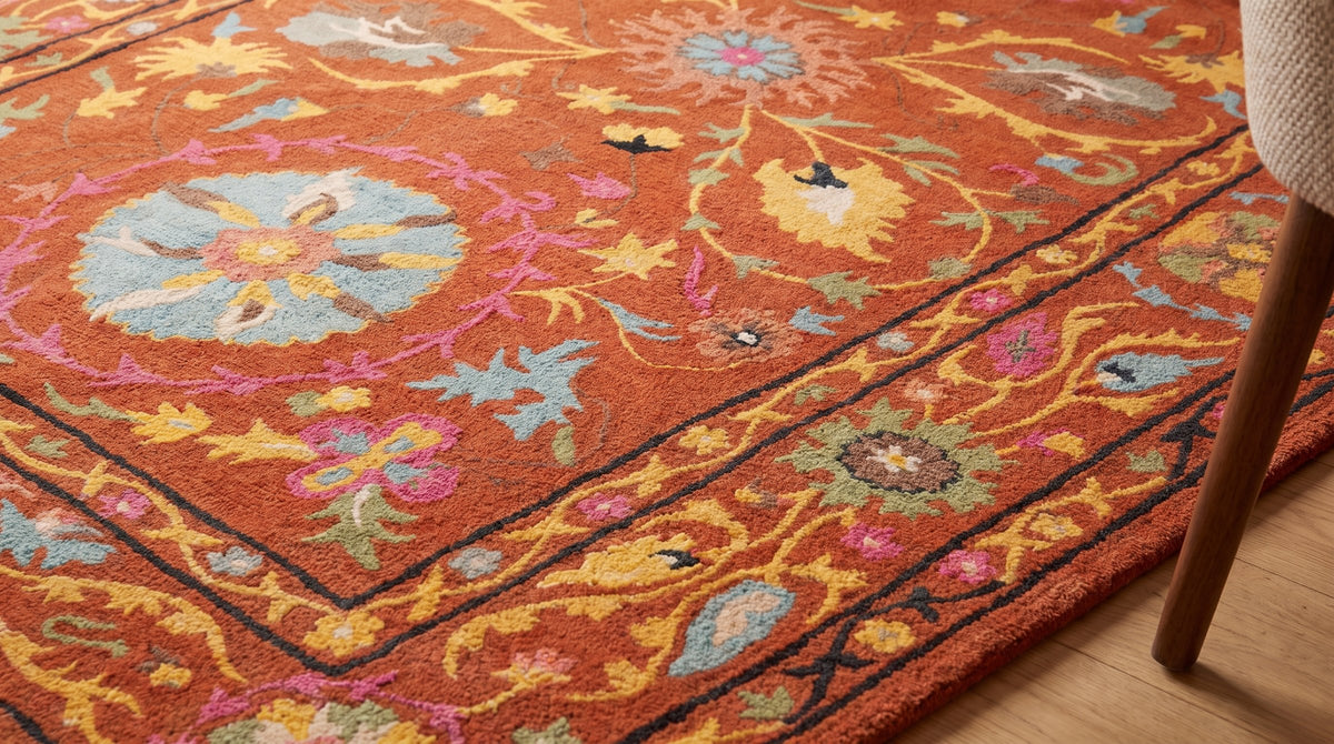 Willow Rust Hand Tufted Wool Rug in a dining room