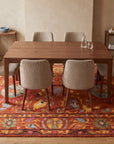 Willow Rust Hand Tufted Wool Rug in a dining room
