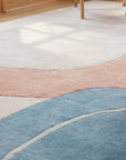 Yara Laine Multicolor Hand Tufted Wool Rug in a sunroom