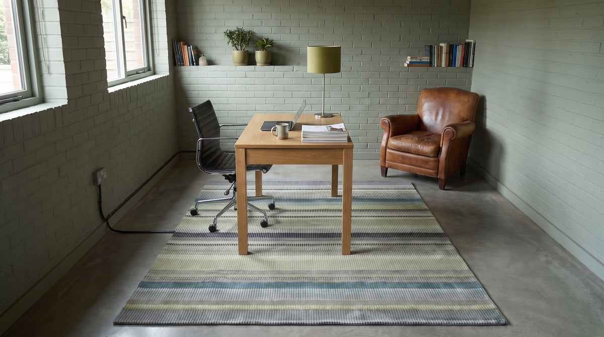 Zinnia Striped Green Handmade Wool Rug in a home office